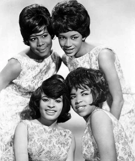 Black-and-white publicity photo of The Marvelettes posing together